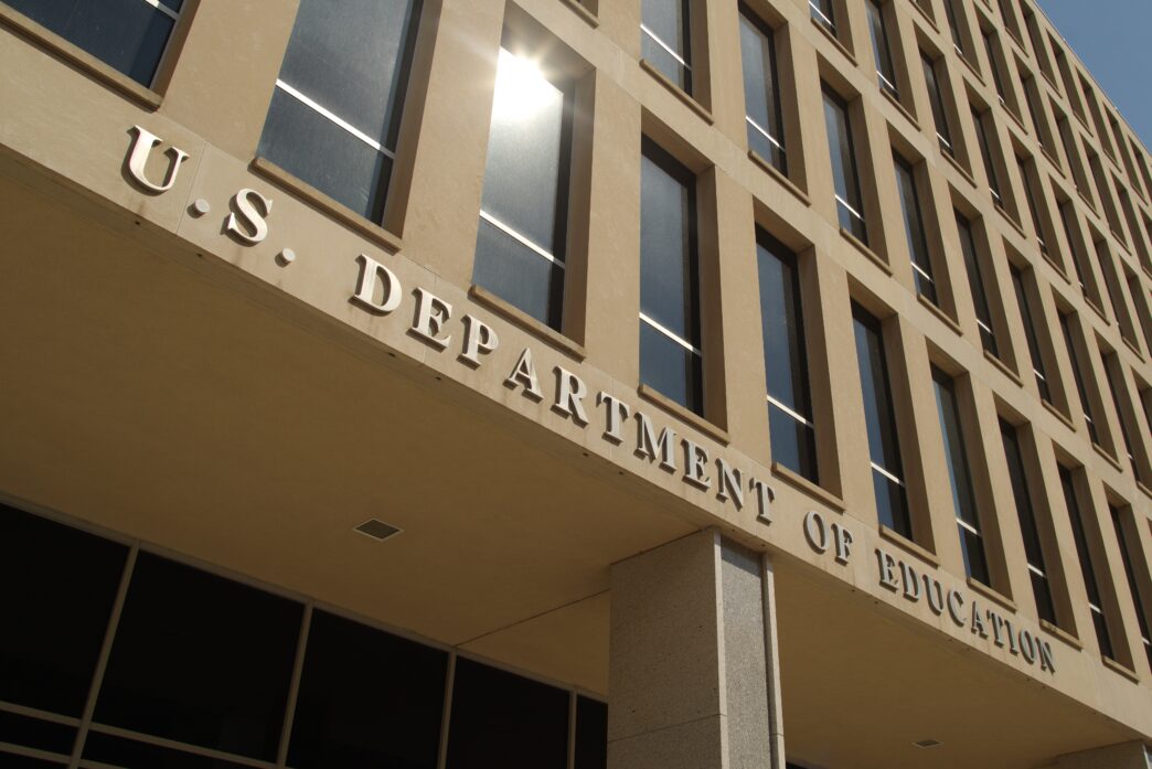 Low-angle view of the inscription "U.S. DEPARTMENT OF EDUCATION" on the building facade.