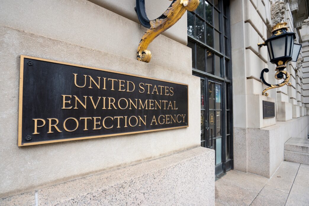 Bronze plaque sign for the "United States Environmental Protection Agency" at a building entrance.