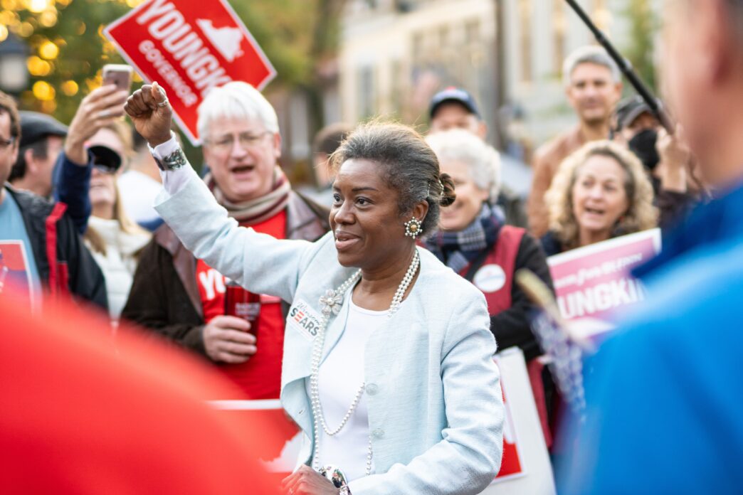 Winsome Sears, Republican candidate, raising her fist while addressing a crowd.
