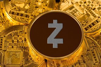 Close-up of a physical Zcash cryptocurrency coin with its 'Z' symbol centered on a brown field, surrounded by gold Bitcoin coins.