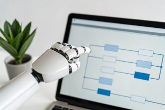 An AI robot hand points at a circuit diagram displayed on a laptop screen.