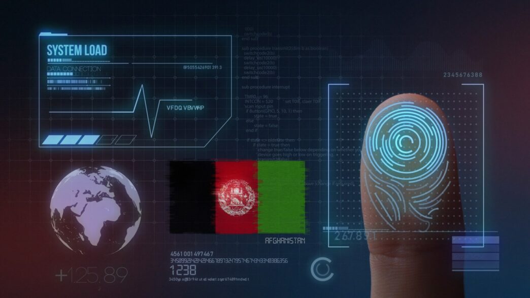 A close-up of a finger being scanned by a biometric device, likely for identification purposes.