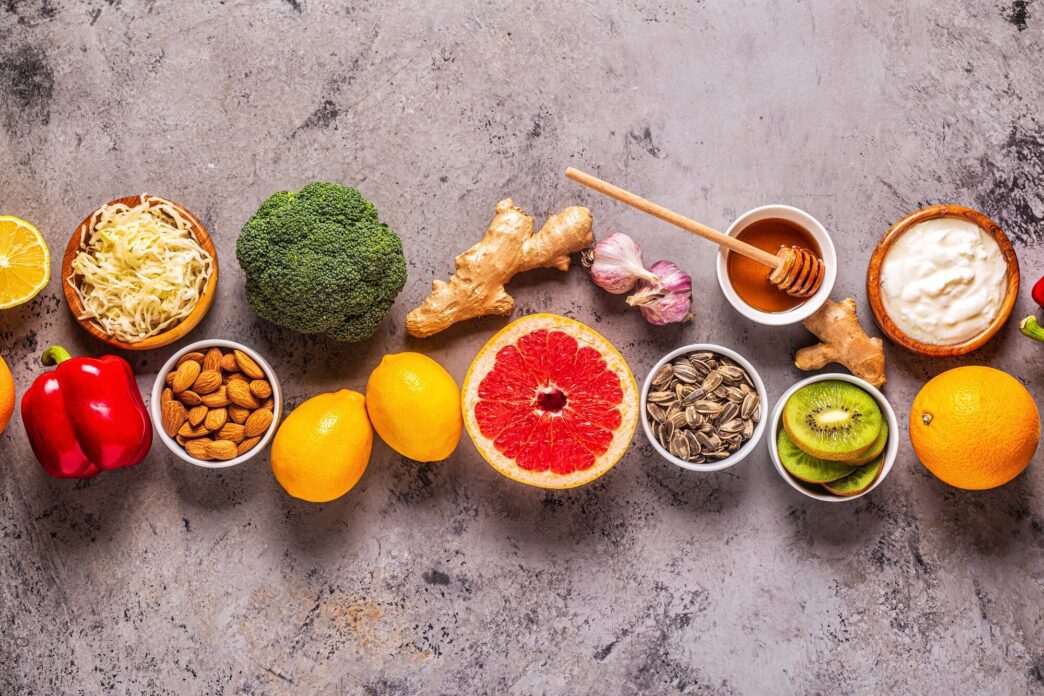 Overhead view of a variety of healthy products, such as supplements and remedies, arranged to boost immunity and combat colds.