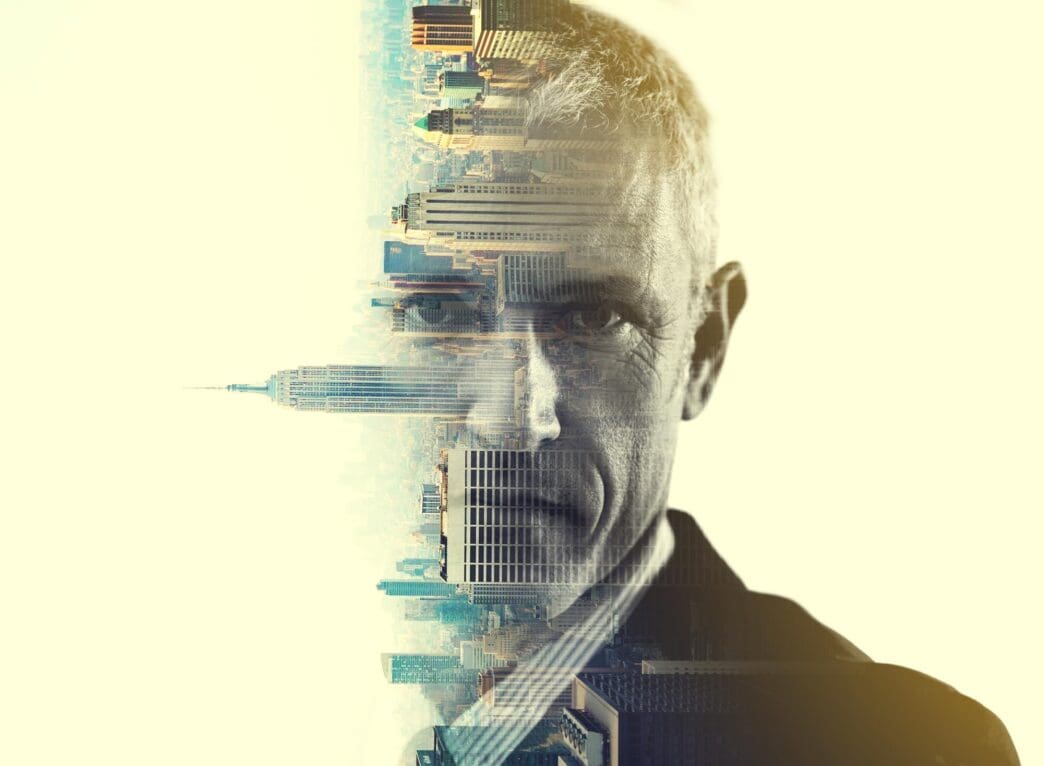 Multiple exposure portrait of a businessman superimposed over a cityscape, creating a visual metaphor for his influence.