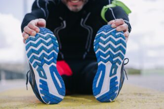 Low-angle shot of a man exercising outdoors.