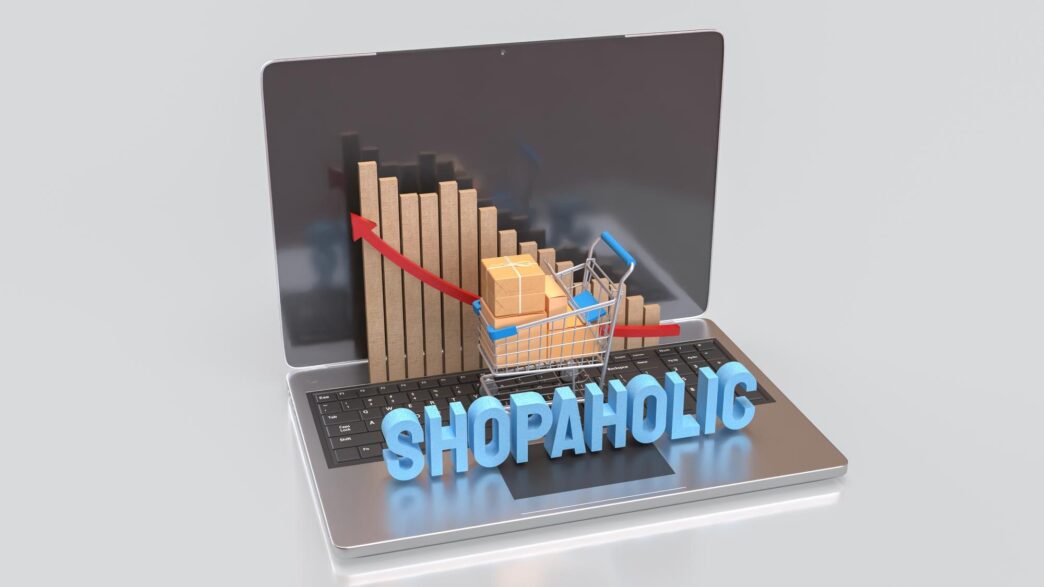 A 3D rendering depicts a laptop screen displaying a shopping cart and a box, symbolizing online shopping.