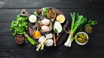 A top-down view shows a small container of white tartar sauce, with empty space surrounding it.