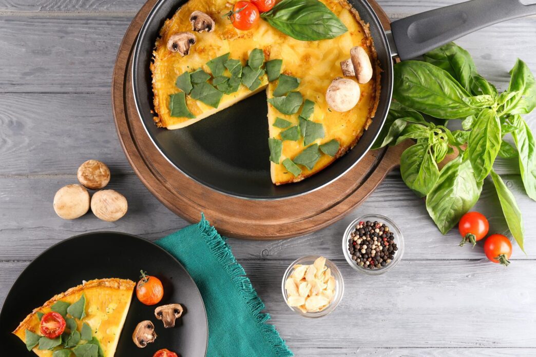 A spinach frittata sits on a table.
