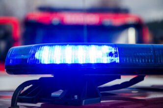 Fire truck lights visible during Tellico Plains camper fire investigation