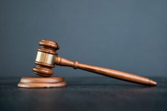 Court legal graphic representing bus fatality lawsuit settlement