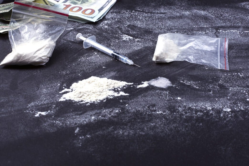 Drugs and weapons seized during a narcotics investigation forfeiture case.