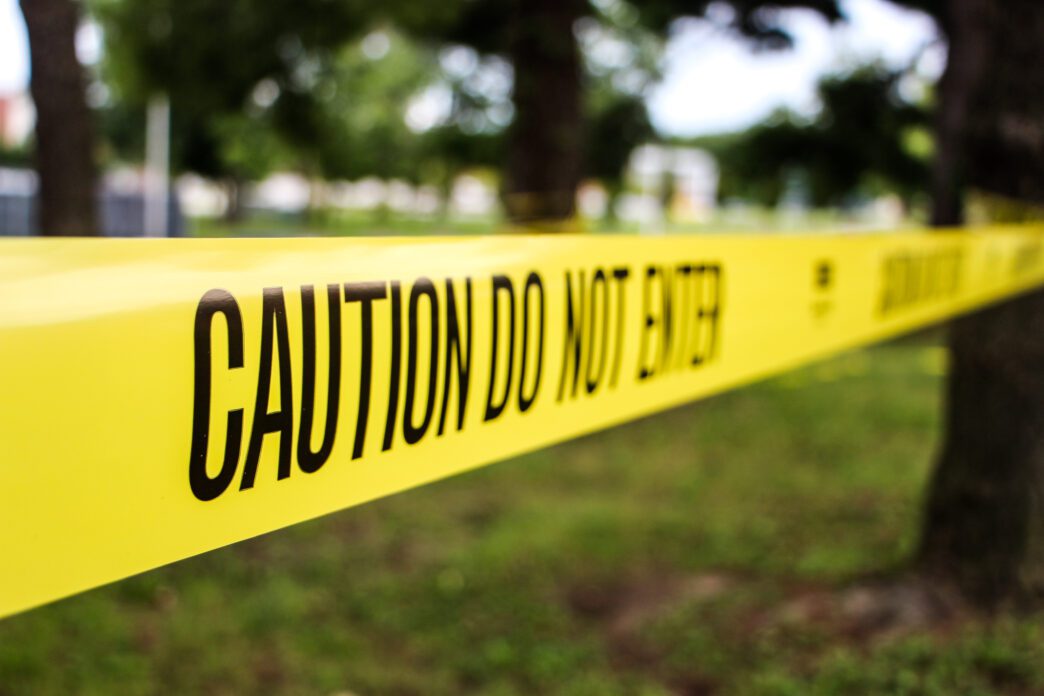 Law enforcement officers investigating a homicide scene in Downers Grove.