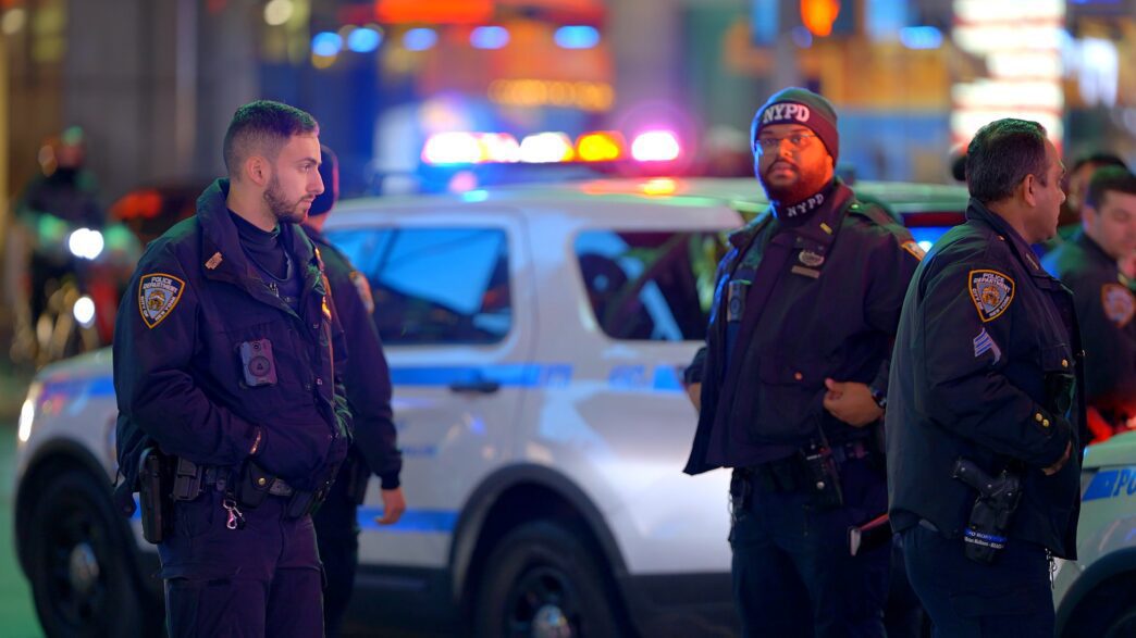 Police officers on duty responding to a carjacking incident.