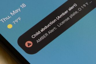 A smartphone lock screen displays an AMBER Alert notification for a child abduction case.