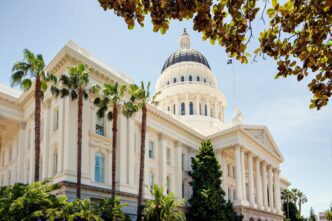 California State Capitol building in Sacramento surrounded by palm trees, photo by JasonDoiy-Shutterstock.