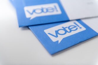 Mail-in ballots for US elections are displayed in close-up by Anna Hoychuk.