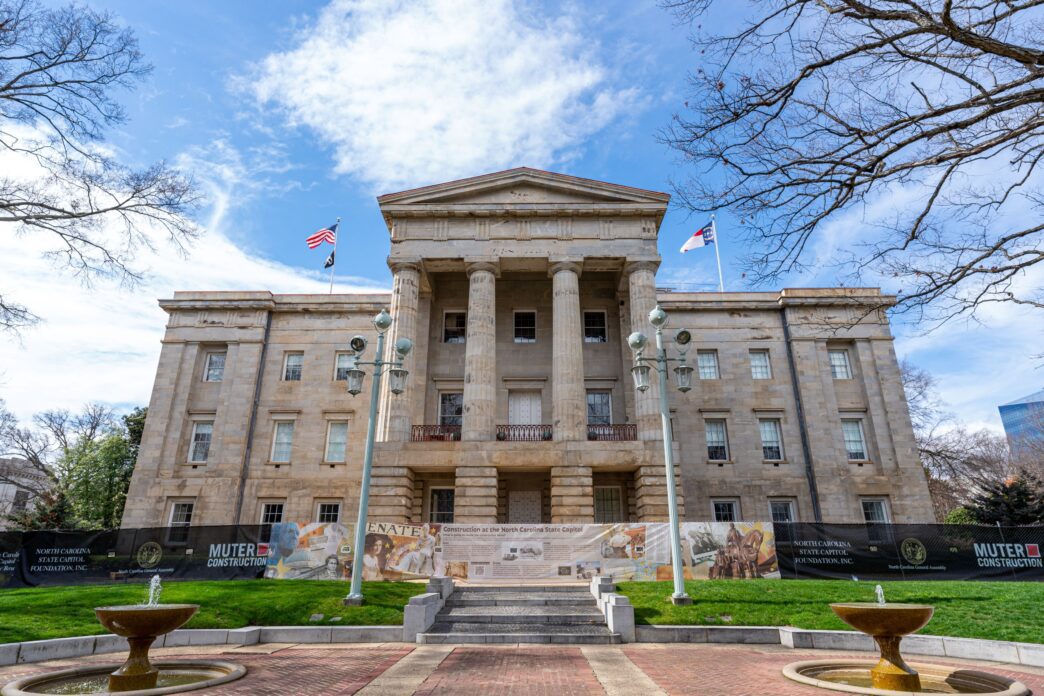 The North Carolina State Capitol Building in Raleigh, USA, captured on March 4th, 2024, with construction banners visible.