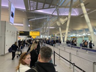 Travelers wait in a TSA PreCheck security line at John F. Kennedy Airport in Queens, New York.