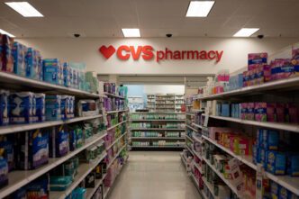 CVS pharmacy section inside a Target store in Tigard, Oregon, displaying various health products on shelves.