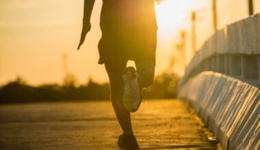 Runner at dawn on a causeway