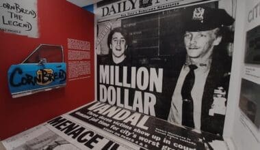 A historic newspaper wall stretching from ceiling to floor at the Museum of Graffiti.