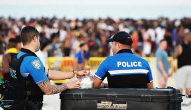 Police officers monitor crowd gathering at South Beach for annual spring break