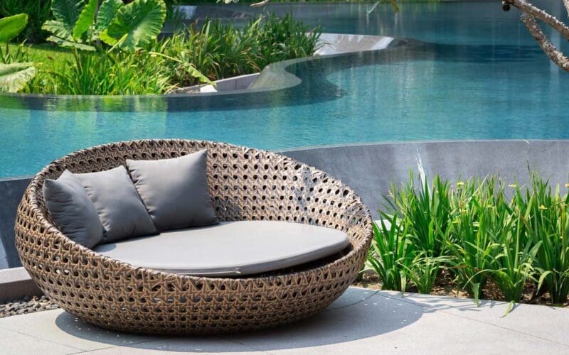 Relaxing Rattan Sofa At Swimming Pool