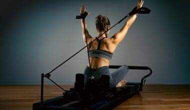 Young girl doing Pilates exercises with a reformer couch