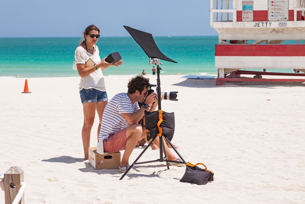 Photographer and his assistant at photo shoot in South Beach - Miami