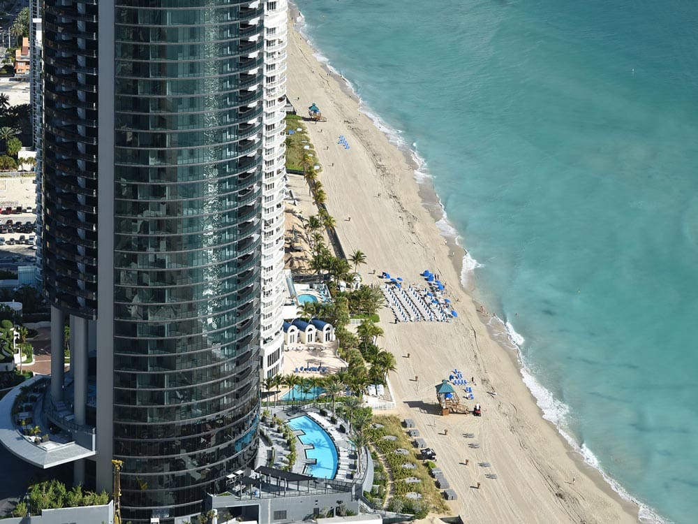 Porsche Design Tower overlooking the beach